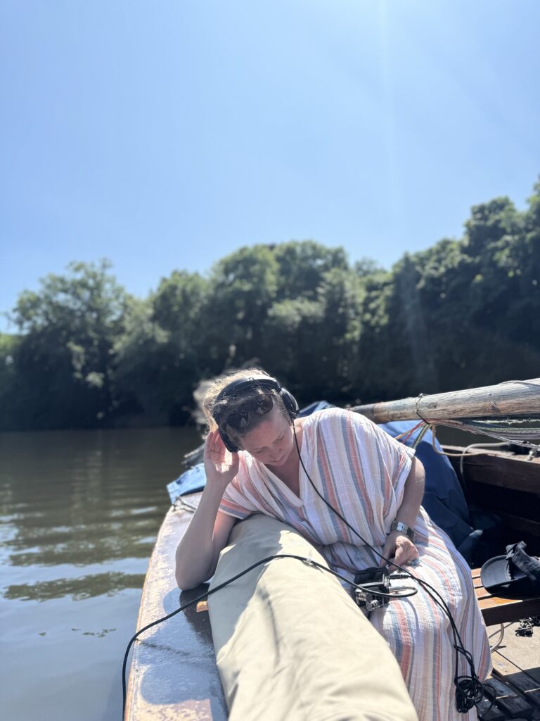Vivienne on sailboat with hydrophone